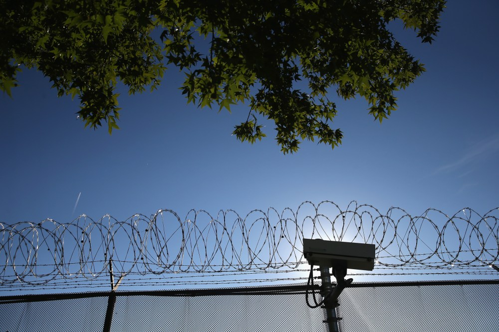 Concertina wire and a security camera line the perimeter of the York County Dentention Center, Sept. 15, 2015 in York, Penn. (Photo by John Moore/Getty)