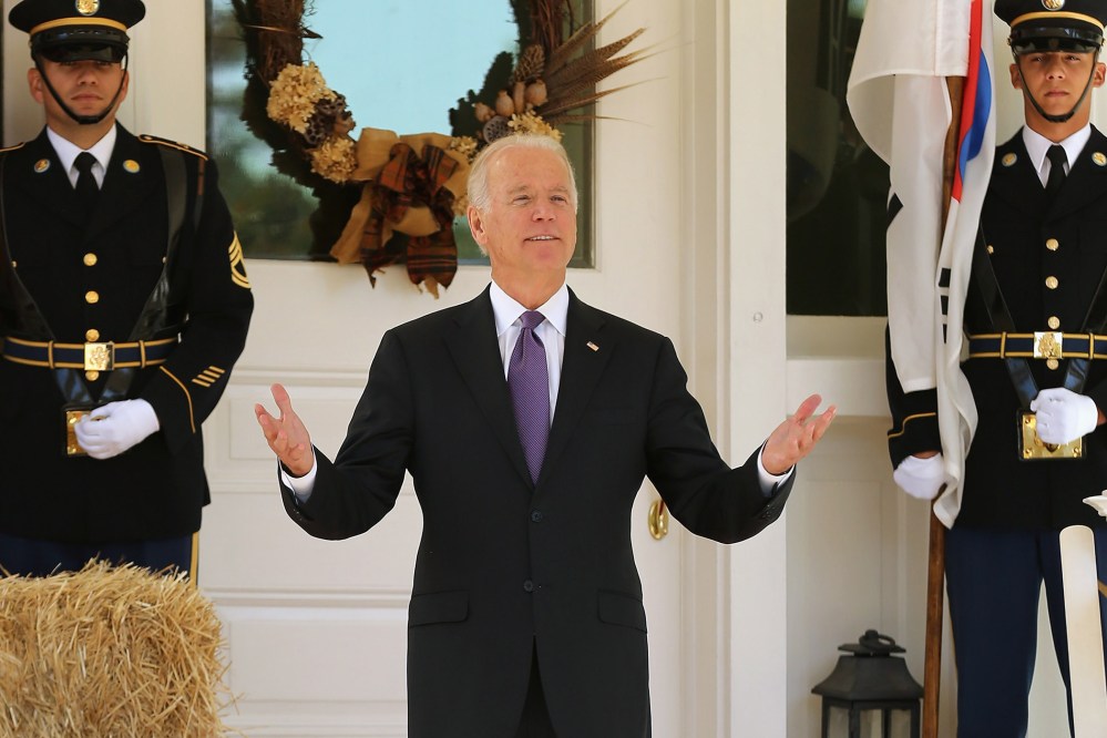 Vice President Joe Biden reacts to reporters' questions about him running for president while he waits for the arrival of President Park Geun-hye of South Korea at the Naval Observatory, Oct. 15, 2015 in Washington, DC. (Photo by Chip Somodevilla/Getty)