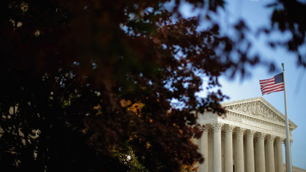 The United States Supreme Court building is framed by fall foliage Nov. 6, 2015 in Washington, DC. (Photo by Chip Somodevilla/Getty)