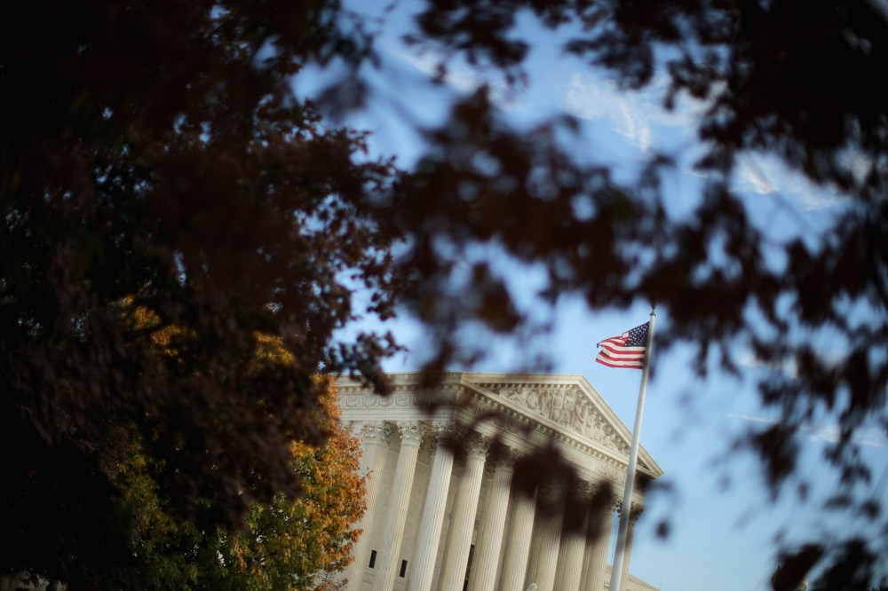 The United States Supreme Court building is framed by fall foliage on Nov. 6, 2015 in Washington, D.C. (Photo by Chip Somodevilla/Getty)