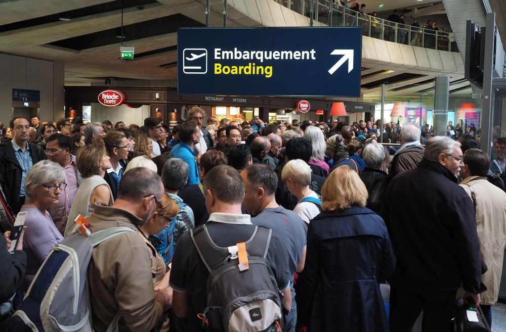 Tourists are seen as they wait in queues after they swarmed Charles De Gaulle airport in Paris, France, Nov. 14, 2015 following the attacks that left at least 128 people dead and 180 injured. (Photo by Mustafa Yalcin/Anadolu Agency/Getty)