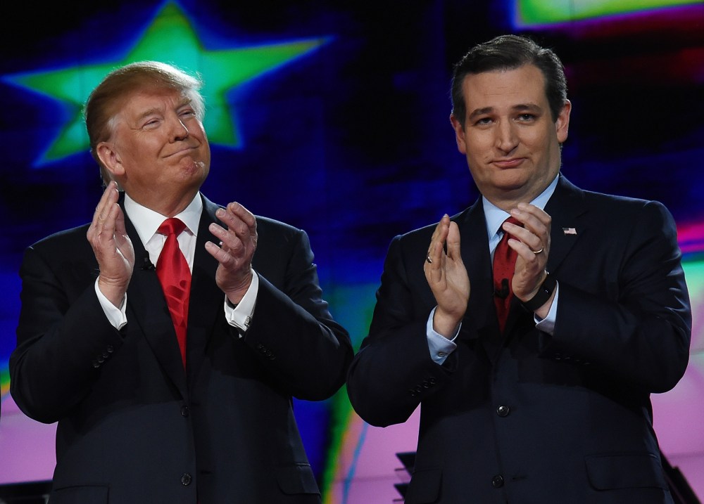 Republican presidential candidates Donald Trump and Sen. Ted Cruz (R-TX) applaud as they are introduced during the CNN presidential debate at The Venetian Las Vegas on Dec. 15, 2015 in Las Vegas, Nev. (Photo by Ethan Miller/Getty)