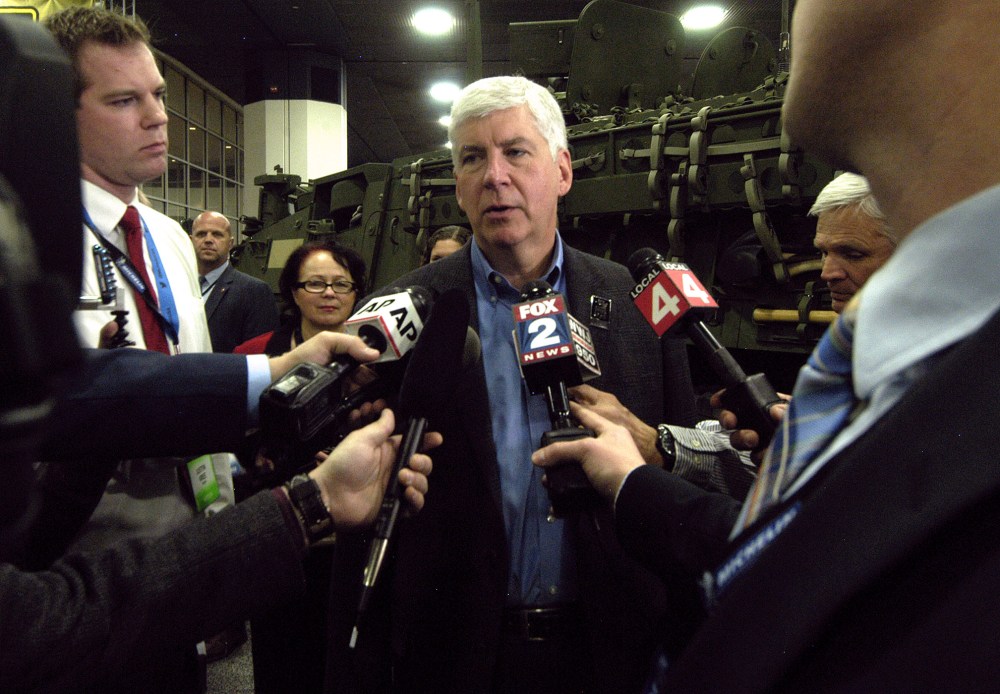 Michigan Governor Rick Snyder talks to reporters during the press preview for the 2016 North American International Auto Show at Cobo Hall, Jan. 12, 2016 in Detroit, Mich. (Photo by Paul Warner/Getty)