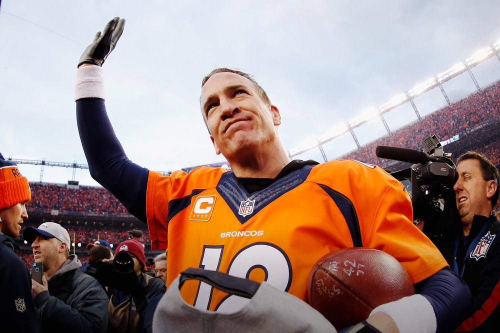 Quarterback Peyton Manning #18 of the Denver Broncos waves after defeating the New England Patriots at the AFC Championship game, Jan. 24, 2016 in Denver, Colo. (Photo by Christian Petersen/Getty)