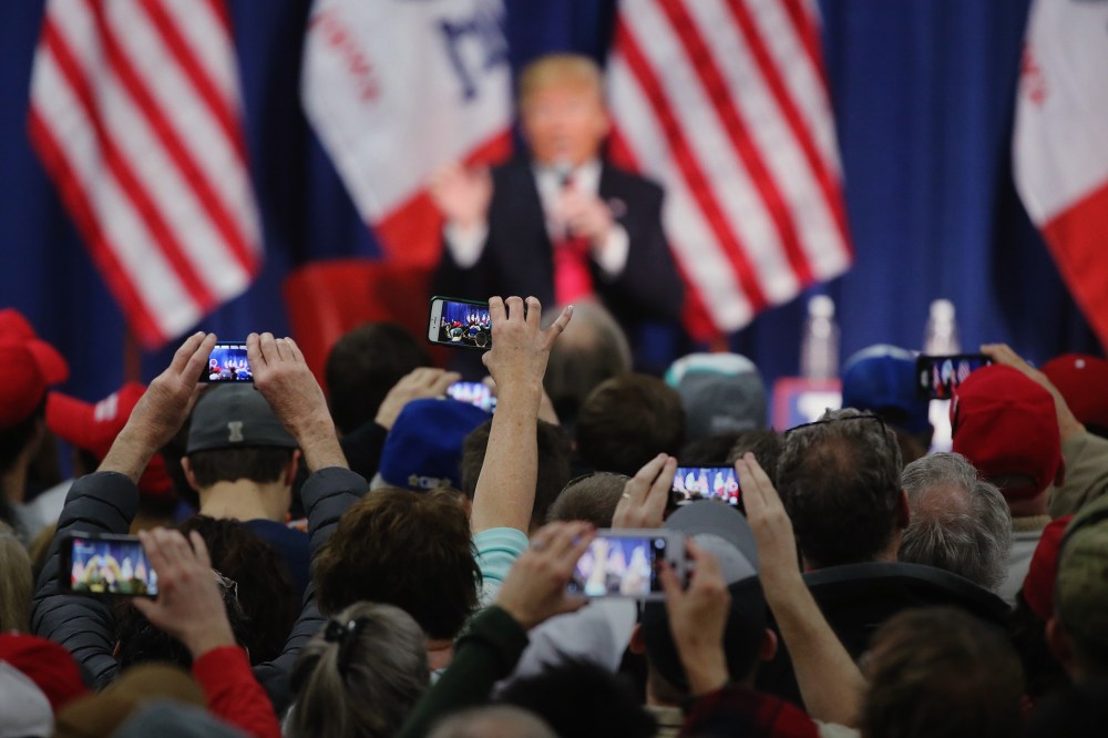 People photograph Republican presidential candidate Donald Trump with their smart phones as he speaks to guests during a campaign rally at the Gerald W. Kirn Middle School on Jan. 31, 2016 in Council Bluffs, Iowa. (Photo by Christopher Furlong/Getty)