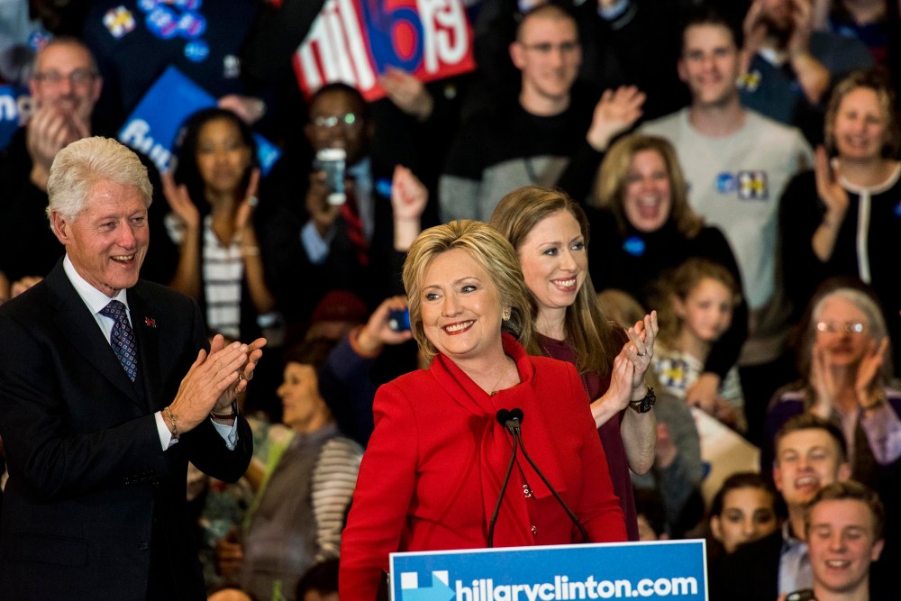 Former Secretary of State Hillary Clinton, with her husband former President Bill Clinton and daughter Chelsea Clinton, Feb. 1, 2016. (Photo by Melina Mara/The Washington Post/Getty)