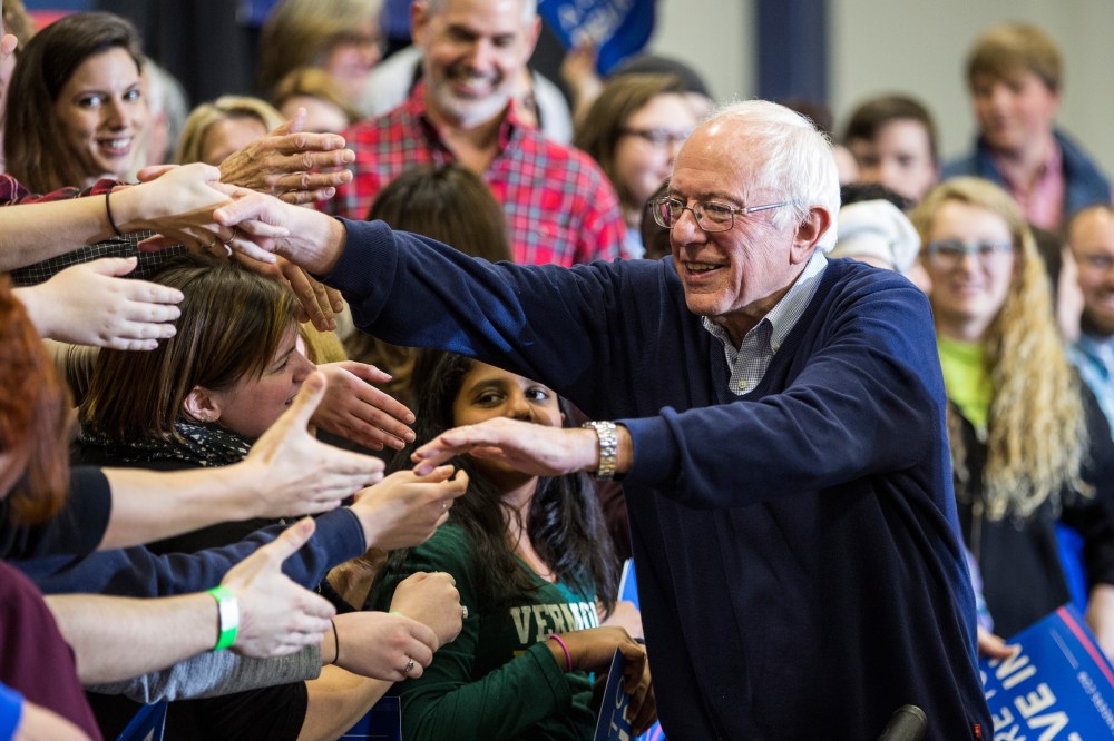 Democratic presidential candidate Sen. Bernie Sanders (D-VT) shakes hands with supporters at a campaign rally at Great Bay Community College on Feb. 7, 2016 in Portsmouth, N.H. (Photo by Andrew Burton/Getty)