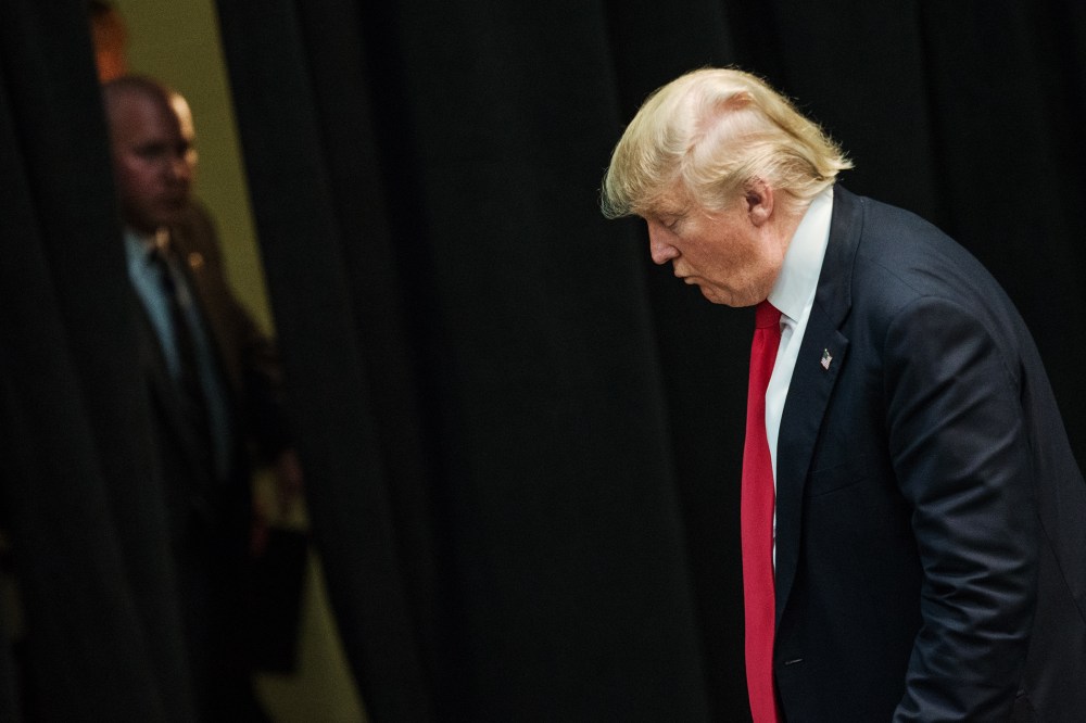 Republican presidential candidate Donald Trump makes his way to an exit at a campaign rally March 7, 2016 in Concord, N.C. (Photo by Sean Rayford/Getty)