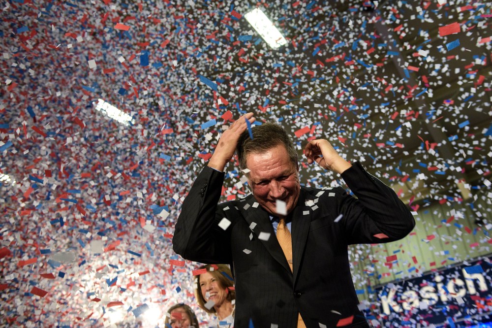 Republican Presidential hopeful Ohio Governor John Kasich celebrates his Ohio primary victory during voting day rally at Baldwin Wallace University March 15, 2016 in Berea, Ohio. (Photo by Brendan Smialowski/AFP/Getty)