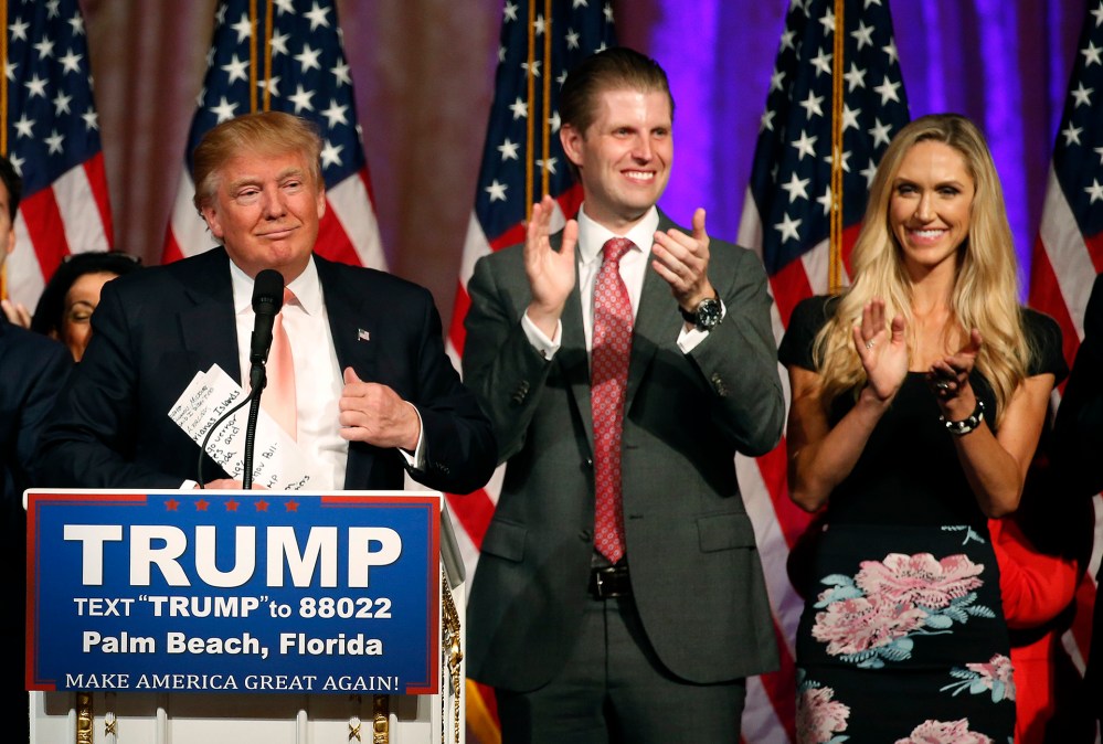 Republican presidential candidate Donald Trump (L), with his son Eric Trump and daughter-in-law, Lara Trump, addresses the media following victory in the Florida state primary on March 15, 2016 in West Palm Beach, Fl. (Photo by Rhona Wise/AFP/Getty)