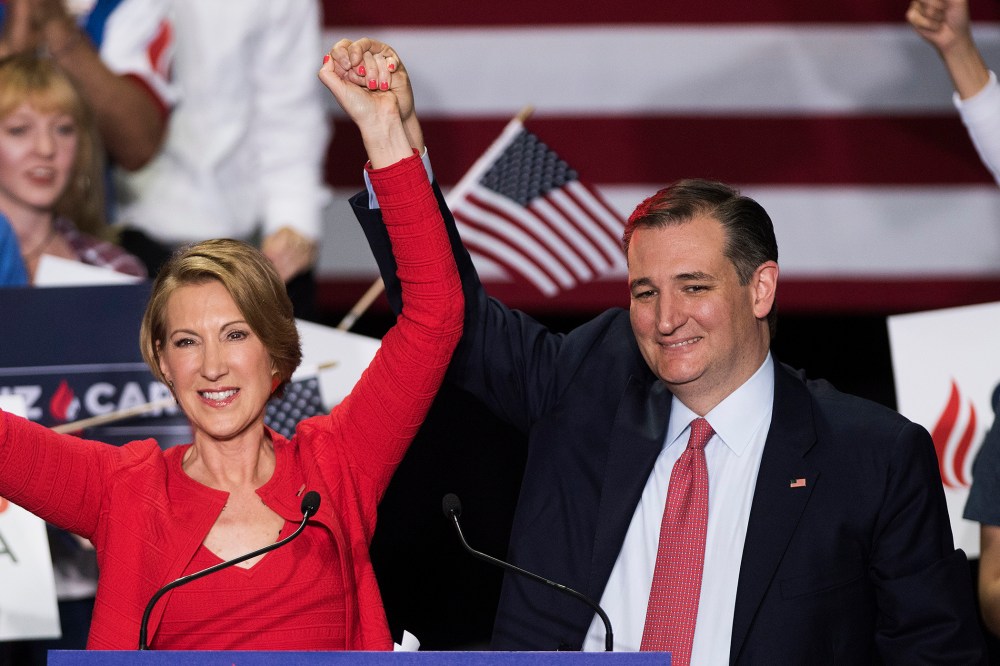 Republican presidential candidate Sen. Ted Cruz (R-TX) holds up hands his new running mate, Carly Fiorina, at a campaign rally at the Pan Am Plaza on April 27, 2016 in Indianapolis, Ind. (Photo by Ty Wright/Getty)
