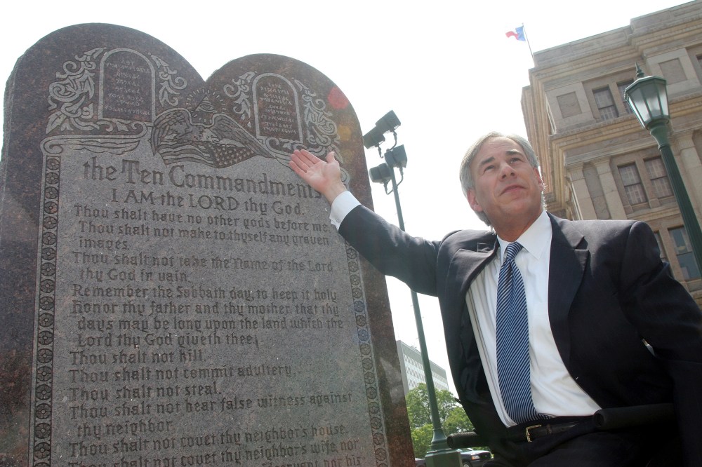 Texas Attorney General Greg Abbott attends a press conference celebrating the U.S. Supreme Court decision that allows a Ten Commandments monument to stand outside the Texas State Capitol in Austin, Texas on Jun. 27, 2005 (Photo by Jana Birchum/Getty).