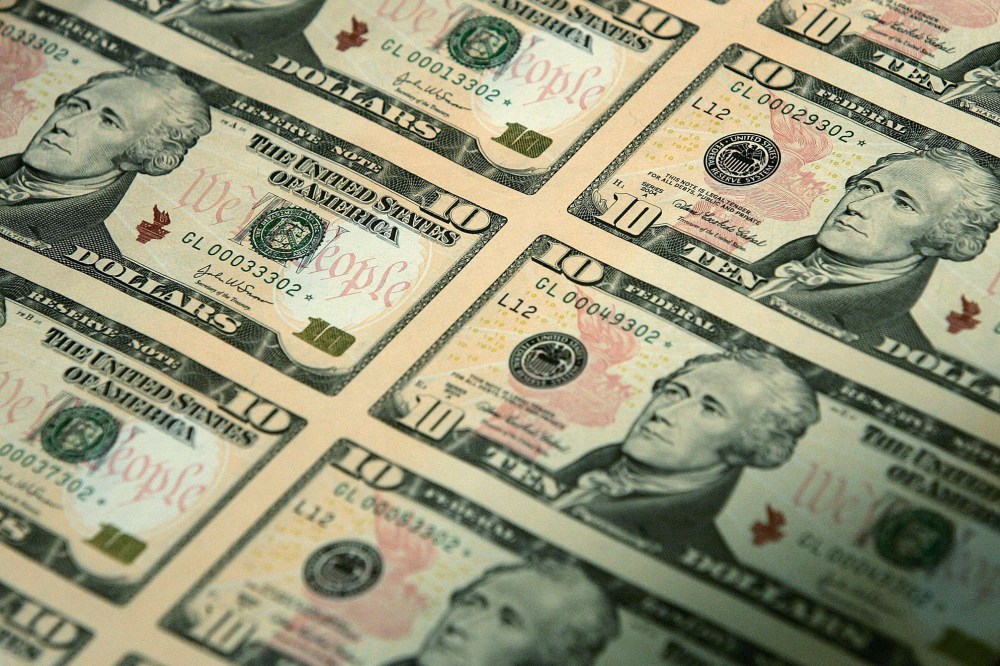 An uncut sheet of the redesigned $10 bill is seen after a news conference to commemorate the first day of circulation of the new notes at the National Archives March 2, 2006 in Washington, DC. (Photo by Alex Wong/Getty)