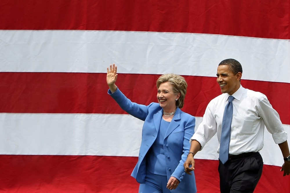 Democratic presidential candidate Sen. Barack Obama (D-IL) and Sen. Hillary Rodham Clinton (D-NY) wave to the crowd June 27, 2008 in Unity, N.H. (Photo by Mario Tama/Getty)
