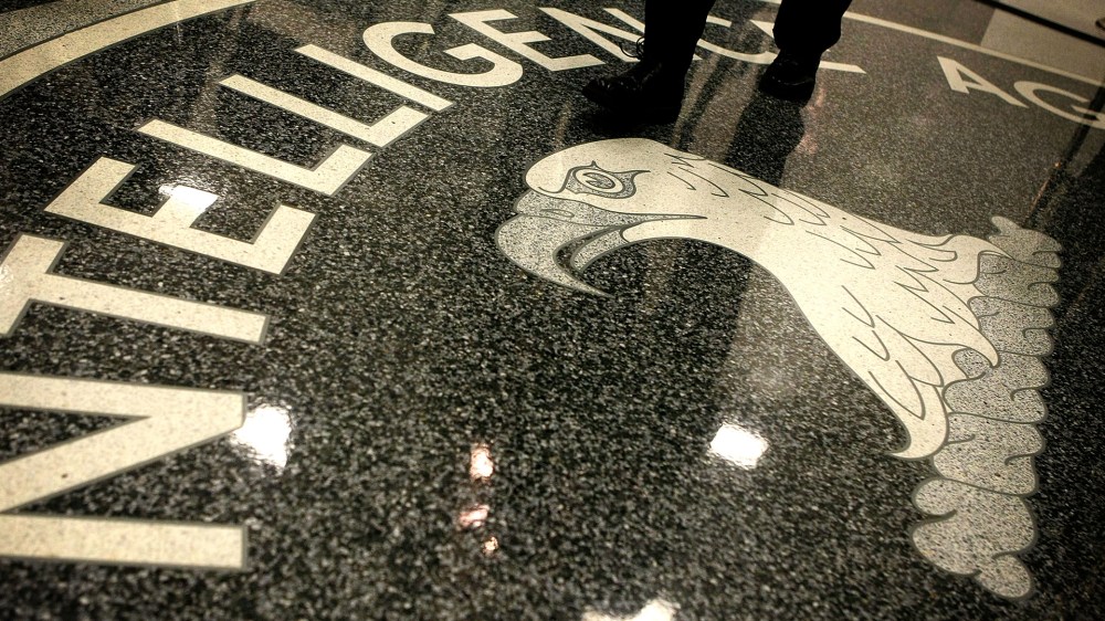 A man walks across the seal of the Central Intelligence Agency at the lobby of the Original Headquarters Building at the CIA headquarters on Feb. 19, 2009 in McLean, Va. (Photo by Alex Wong/Getty)