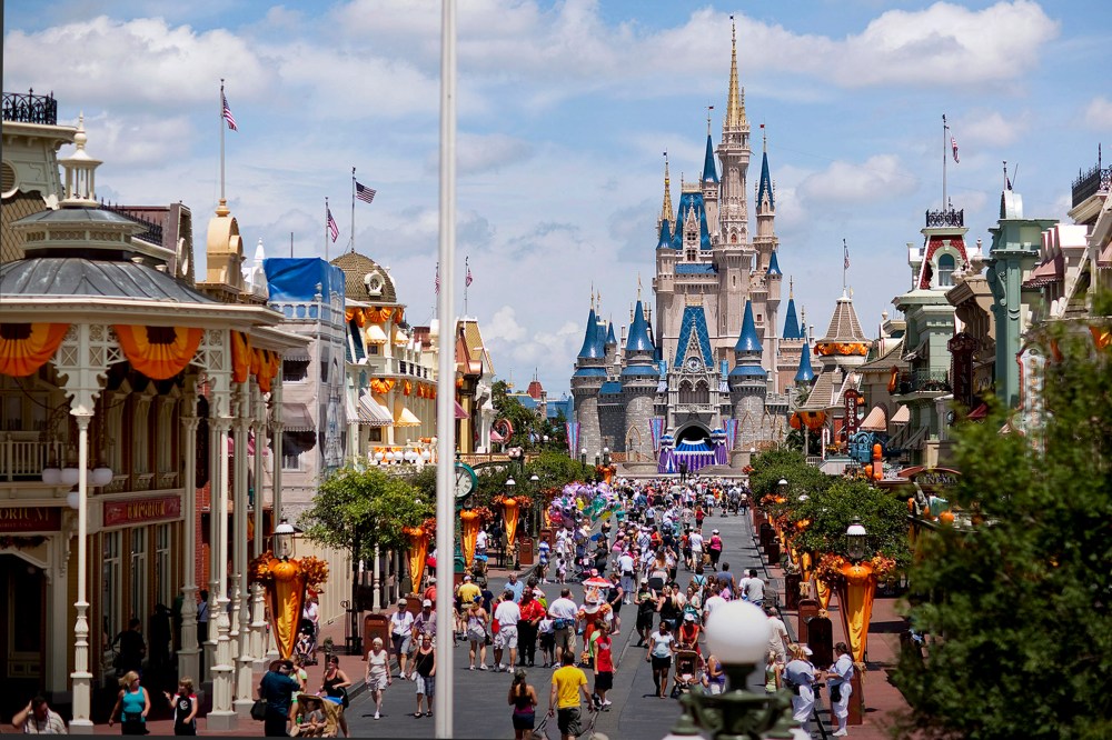 Visitors make their way toward Cinderella Castle at Magic Kingdom, at the Walt Disney World theme park and resort in Lake Buena Vista, Florida. (Photo by Matt Stroshane/Bloomberg/Getty)