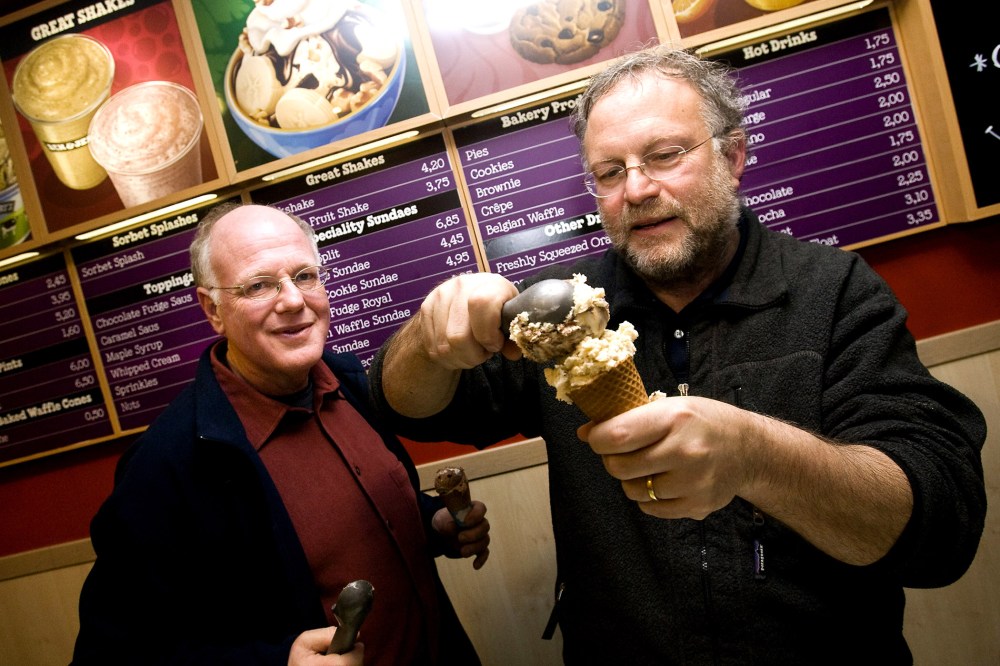 American ice cream makers Ben Cohen and Jerry Greenfield, founders of the brandBen & Jerry's, give out ice creams for free in their shop, Feb. 22, 2010. (Photo by Ade Johnson/AFP/Getty)