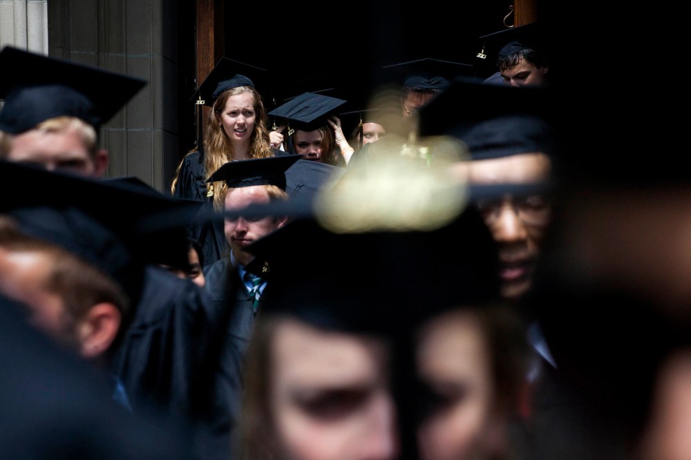 New graduates walk out of the chapel after their commencement at Princeton University in Princeton, New Jersey, U.S., on June 2, 2013.