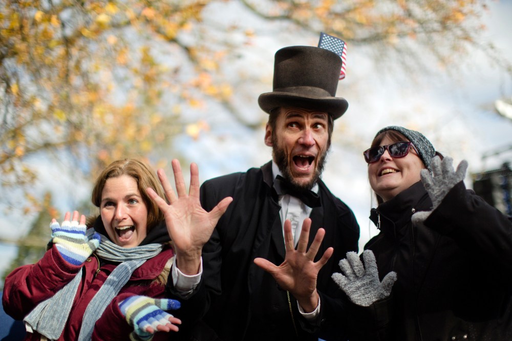 Rick Miller a President Abraham Lincoln re-enactor poses for photographs after a ceremony commemorating the 150th anniversary of the dedication of the Soldiers National Cemetery and President Abraham Lincoln's Gettysburg Address, Tuesday, Nov. 19, 2013,