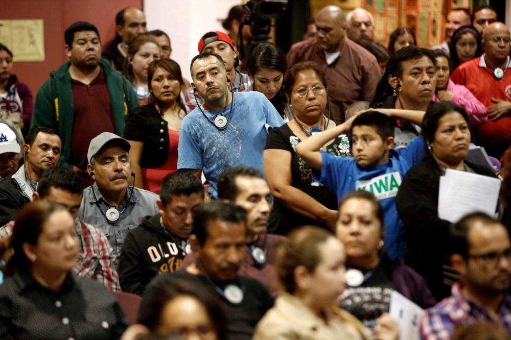 Attendees at a workshop on a new law that allows undocumented immigrants to get driver's licenses, at the Bell Community Center in Bell, Calif.