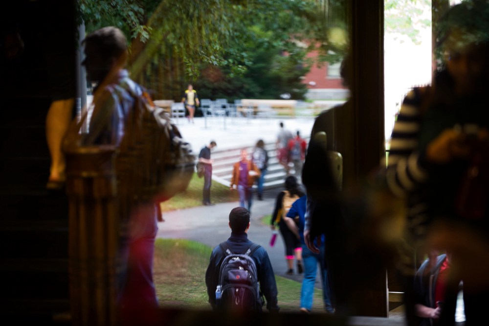 Harvard University students on their way about campus in Cambridge, Mass. (Photo by Gretchen Ertl/The New York Times/Redux)
