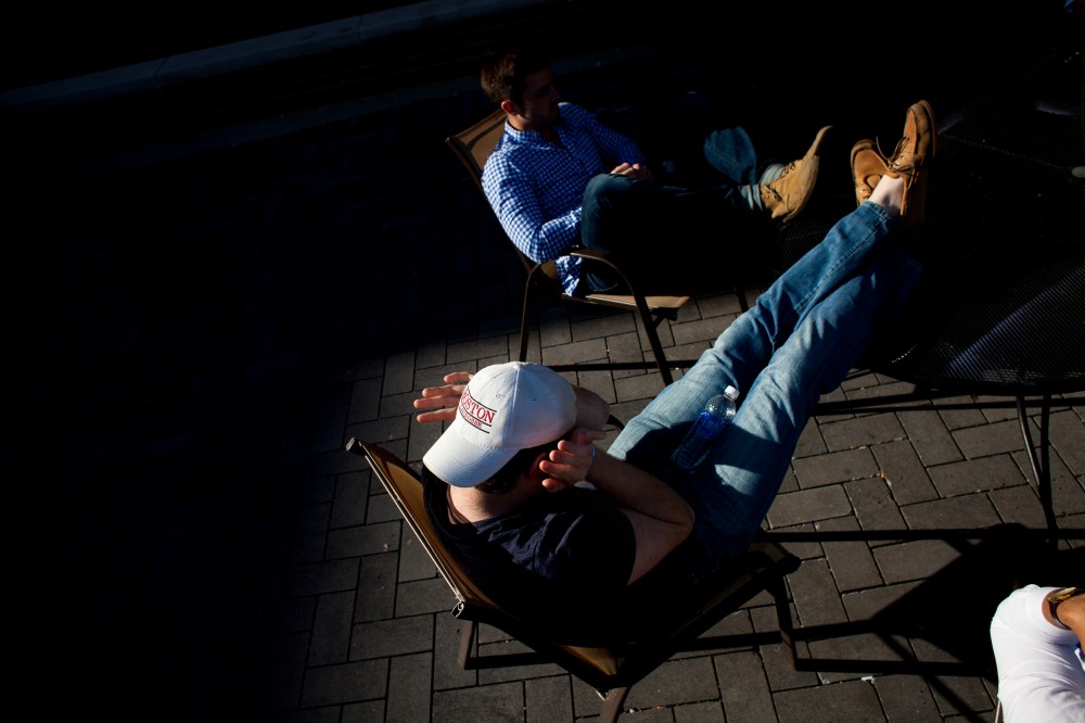 Students sit in the fraternity quad at Northwestern University in Evanston, Ill.