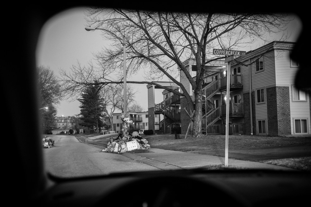 A view through a car window of the street in front of the Canfield apartment complex where teenager Michael Brown was shot and killed is seen on Nov. 28, 2014 in Ferguson, Mo. (Photo by David Butow/Redux)