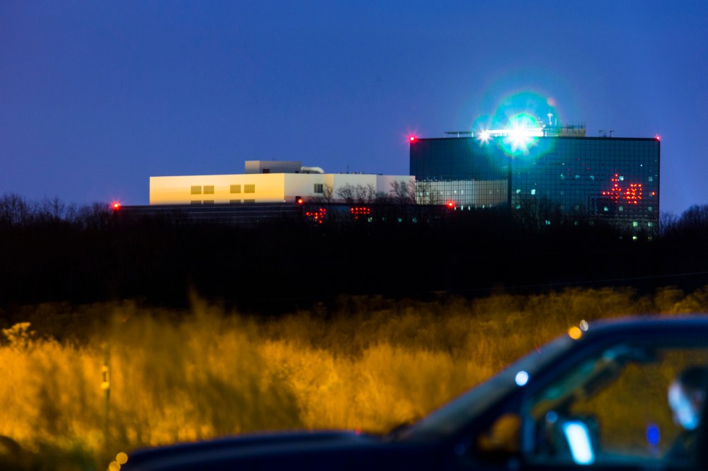 A Maryland State Trooper sits in an unmarked SUV outside the grounds of the National Security Agency (NSA) in Fort Meade, Md. on Dec. 22, 2013.
