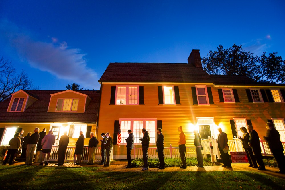Virginia residents wait in line in the pre-dawn hours to vote in the 2014 US midterm elections at a historic property called the Hunter House at Nottoway Park in Vienna, Va, on Nov. 4, 2014. (Photo by Jim Lo Scalzo/EPA)