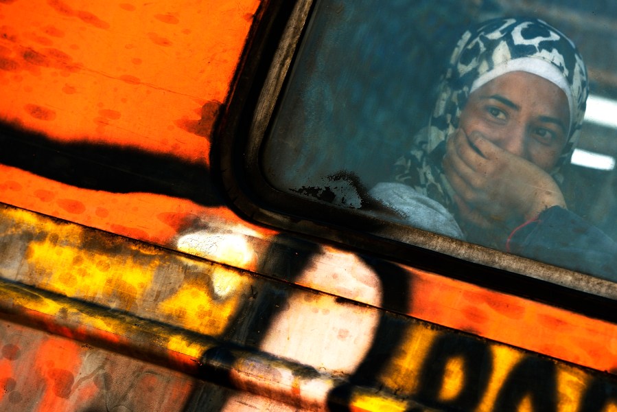 A migrant woman sits in the train at Gevgelija,The Former Yugoslav Republic of Macedonia, on Aug. 25, 2015. (Photo by Vassil Donev/EPA)