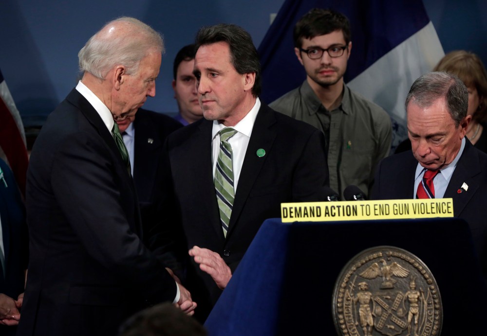 Vice President Joe Biden shakes hands with Neil Heslin, center, whose son Jesse Lewis died at the school shootings in Newtown, Conn., after Biden spoke in New York's City Hall Blue Room, Thursday, March 21, 2013. Relatives of shooting victims from...