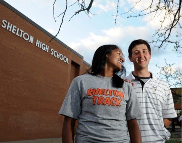 Suspended student James Tate and the girl he asked to prom in front of Shelton High School.
