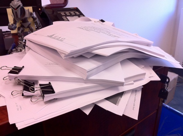 The ever-growing stack of papers on my desk (and yes BSG fans... that's a Cylon)