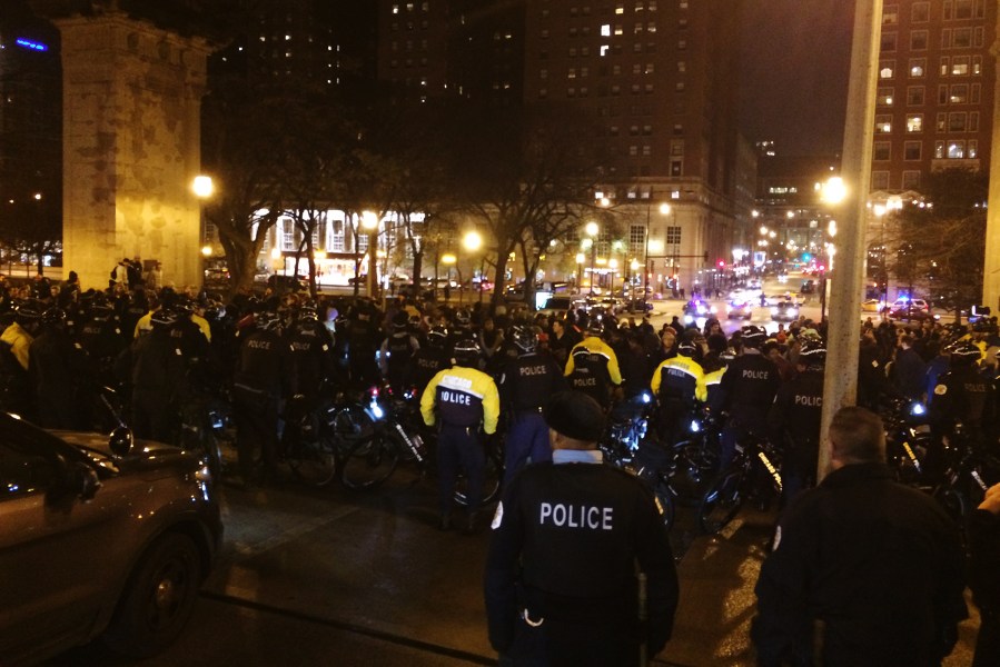 Members of the Chicago police line up in response to a protest after the release of a dashcam video showing the fatal shooting of a young black man at the hands of an officer, Chicago, Nov. 24, 2015. (Photo by Dick Johnson/WMAQ)