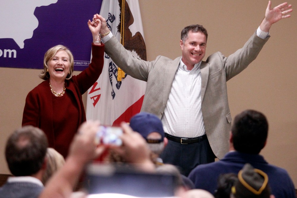 Former Secretary of State Hillary Rodham Clinton speaks and Rep. Bruce Braley, D-Iowa wave to supporters during a campaign even for his senatorial race, Wednesday, Oct. 29, 2014, in Cedar Rapids, Iowa.