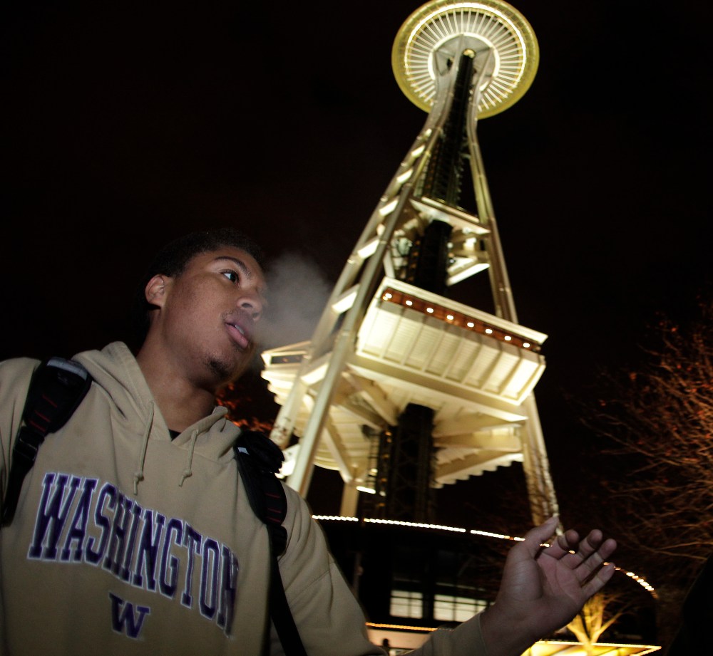Andre Edwards smokes marijuana, just after midnight at the Space Needle in Seattle. Possession of marijuana became legal in Washington state at midnight, and several hundred people gathered at the Space Needle to smoke and celebrate the occasion, even...
