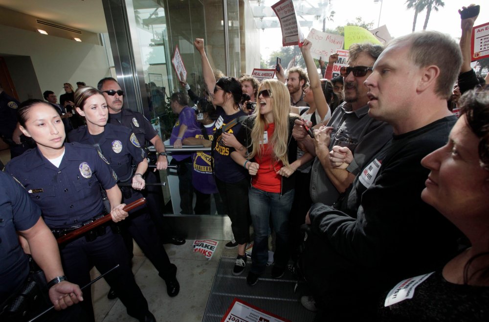 Student demonstrators are confronted by California State University Police officers during a protest Wednesday Nov. 16, 2011