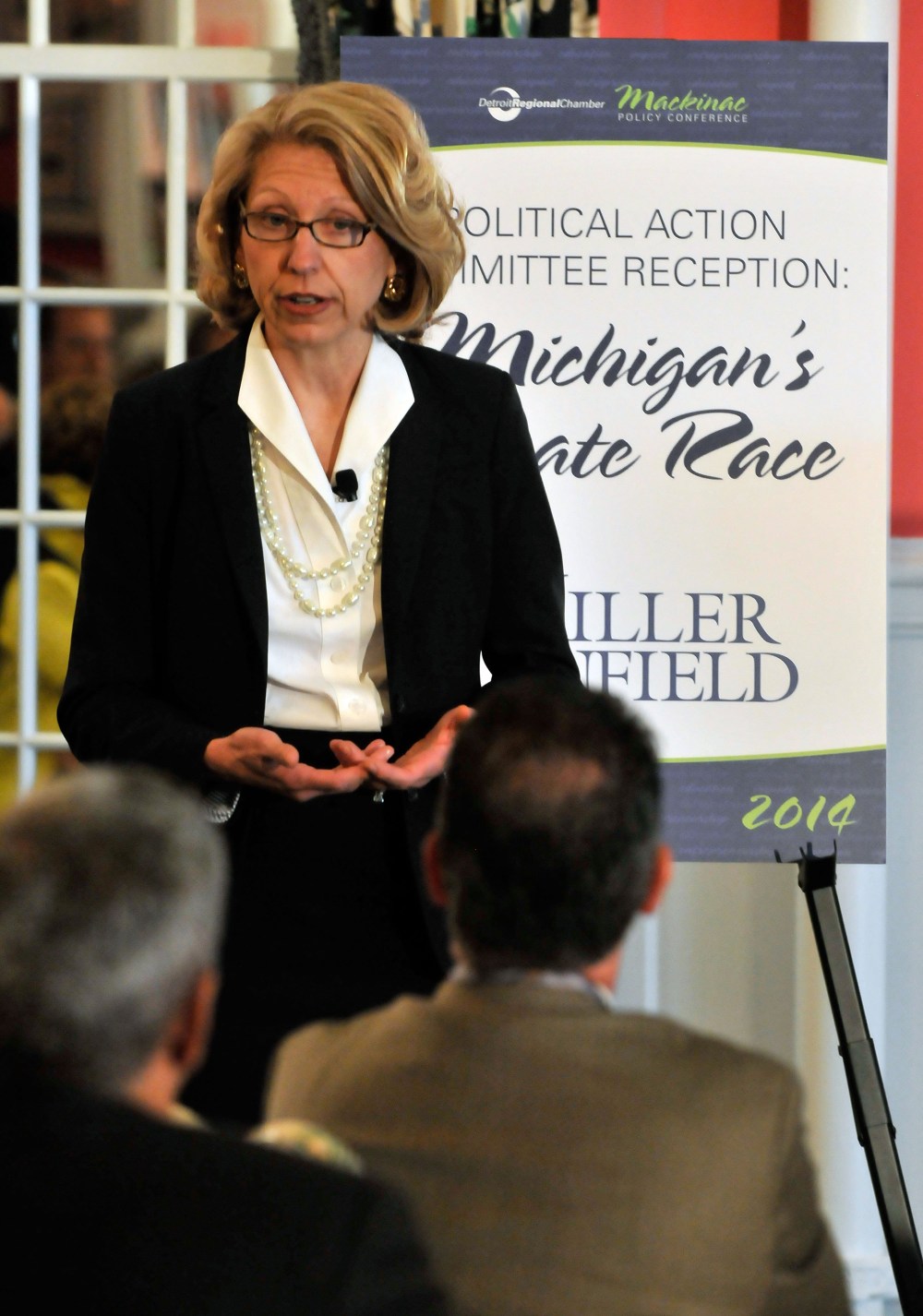 Former Michigan Secretary of State Terri Lynn Land talks during a Political Action Committee reception Wednesday, May 28, 2014, at the 2014 Mackinac Policy Conference at the Grand Hotel on Mackinac Island, Mich.