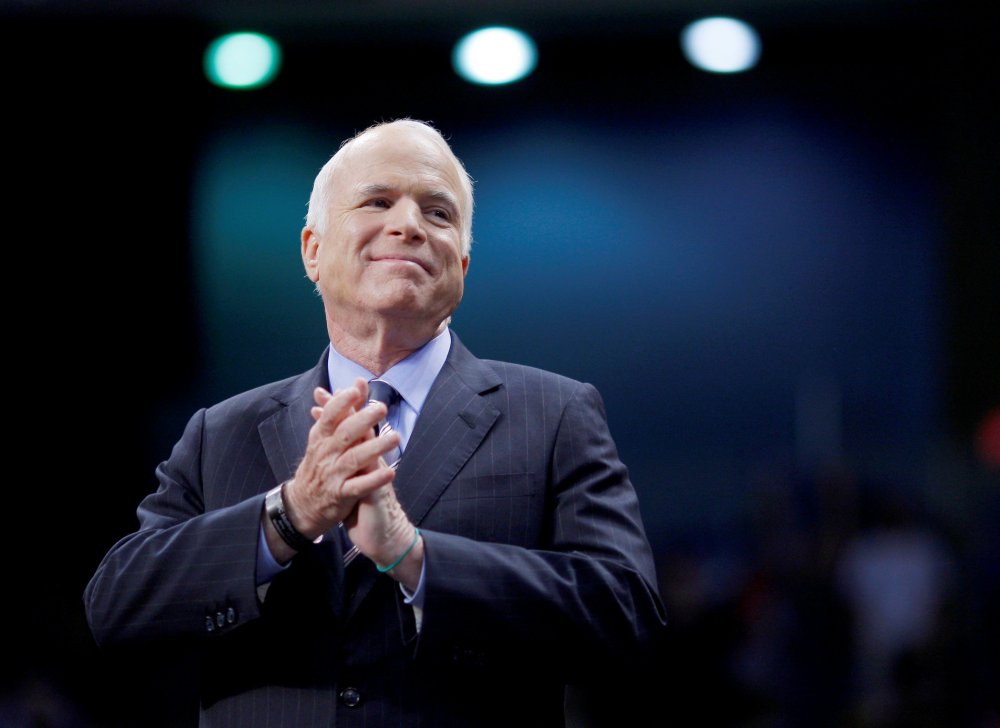 Image: FILE PHOTO: U.S. Republican presidential nominee Senator John McCain listens as he is introduced at a campaign rally in Fayetteville