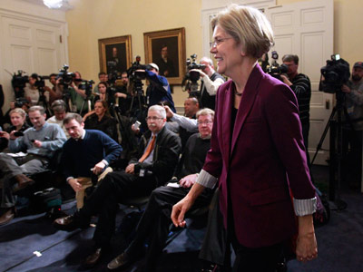 U.S. Sen.-elect Elizabeth Warren, D-Mass., walks past members of the media as she makes her way to the podium before a news conference at the Statehouse, in Boston, Thursday, Nov. 8, 2012. Warren met with Mass. Gov. Deval Patrick Thursday at the...