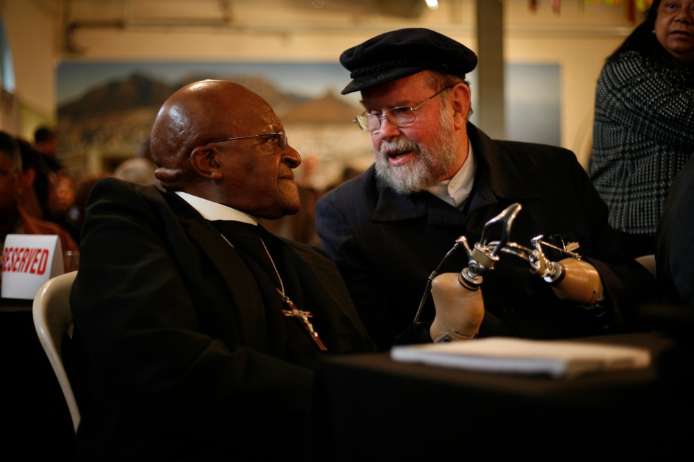 Father Michael Lapsley with Bishop Desmond Tutu (Ret.) last month in Cape Town, South Africa.