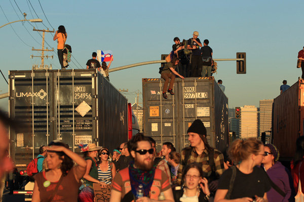 Protesters climbing aboard trucks in Oakland, California on Wednesday.