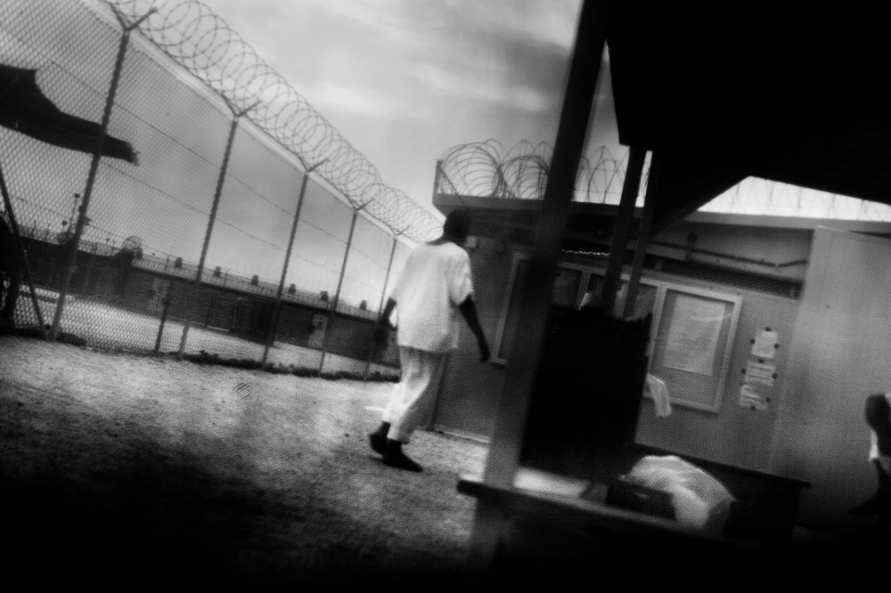 Detainees in are seen camp 4 of Guantanamo Bay in June 2006. (Photo by Paolo Pellegrin/Magnum)