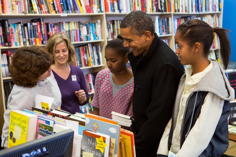 President Barack Obama (2R) and daughters Sasha Obama (C) and Malia Obama (R) shopped at One More Page Books on Small Business Saturday November 24, 2012 in Arlington, Virginia.(Photo by Kristoffer Tripplaar-Pool/Getty Images)