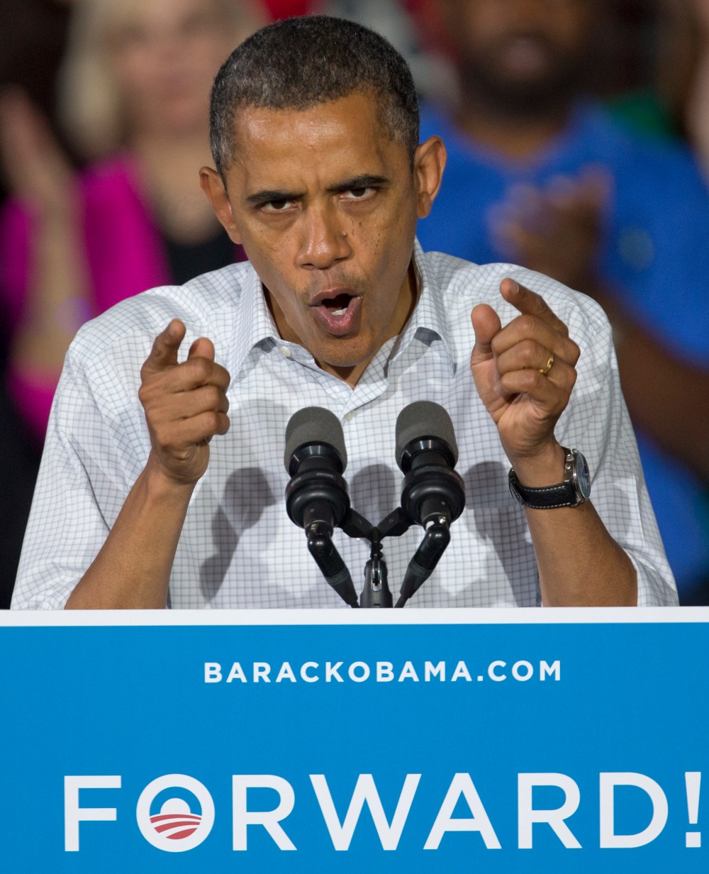 President Obama rallies the crowd at a campaign event at a high school in Mentor, Ohio.(AP Photo/Carolyn Kaster)