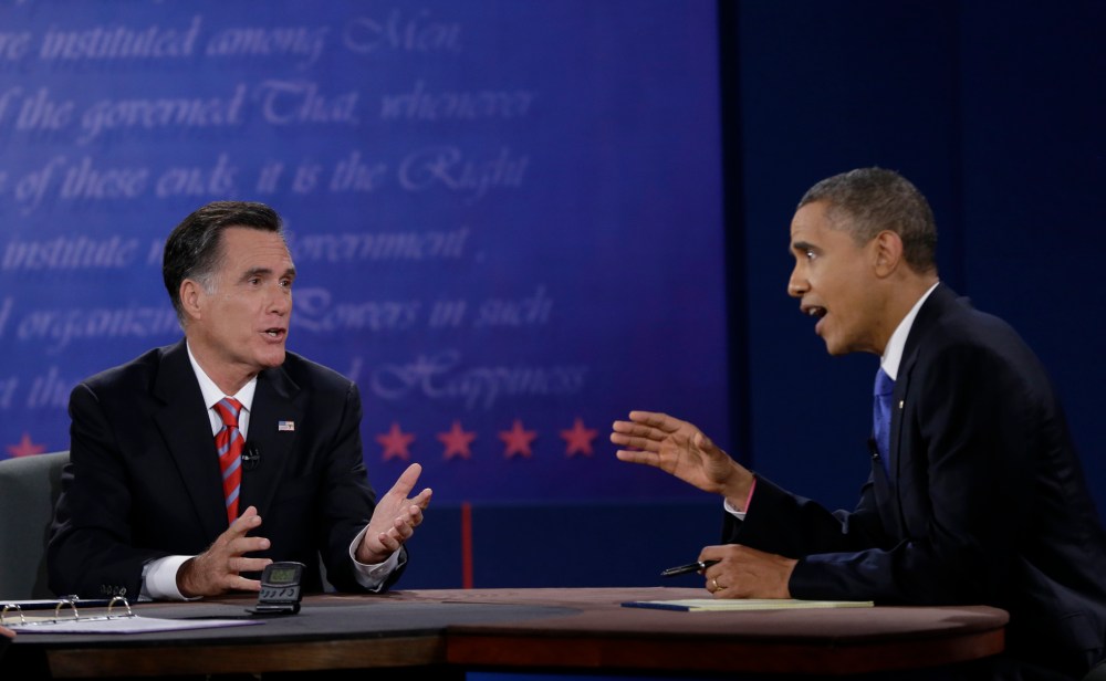 President Barack Obama, right, and Republican presidential nominee Mitt Romney discuss a point during the third presidential debate at Lynn University, Monday, Oct. 22, 2012, in Boca Raton, Fla. AP Photo/Eric Gay