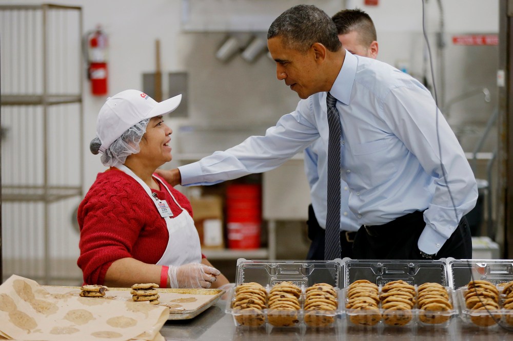President Barack Obama greets an employee in the bakery at a Costco store in Lanham, Md., Jan. 29, 2014.
