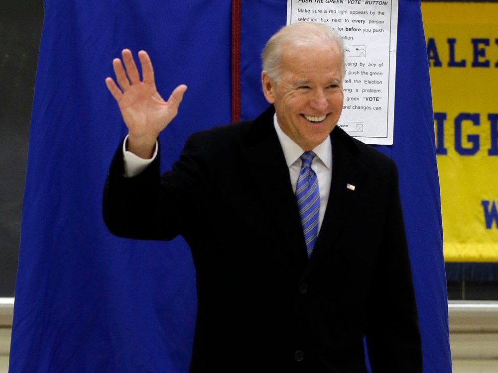 Vice President Joe Biden waves as he exits a voting booth after casting his ballot at Alexis I. duPont High School, Tuesday, Nov. 6, 2012, in Greenville, Del. (Photo by AP Photo/Matt Rourke)