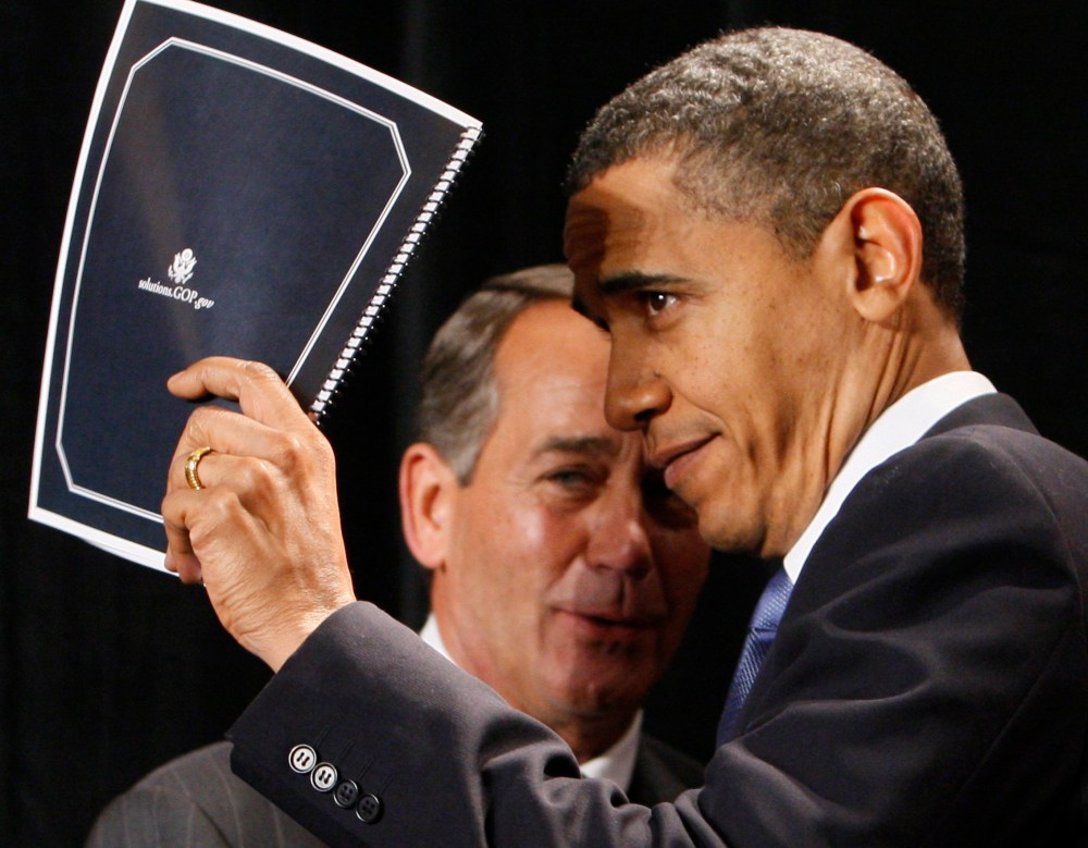 File Photo: President Barack Obama holds up a document of Republican solutions given to him by House Minority Leader John Boehner of Ohio, before addressing Republican lawmakers at the GOP House Issues Conference, in Baltimore, Friday, Jan. 29, 2010. ...