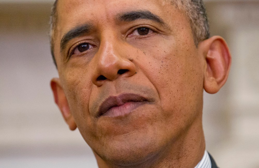 President Barack Obama listens during his meeting in the Oval Office of the White House in Washington, March 12, 2014.